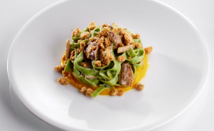 Green fettuccine with porcini mushrooms, pumpkin cream and parmesan crumble